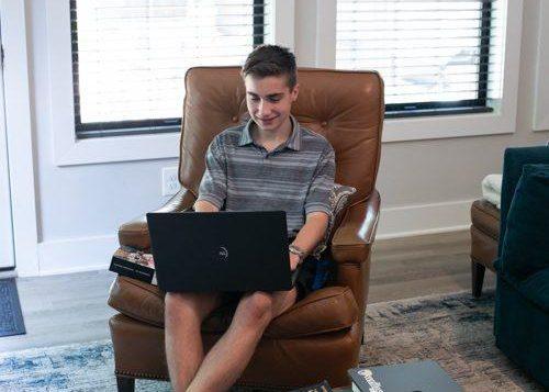 Rhetoric Self-Paced Courses student on a laptop